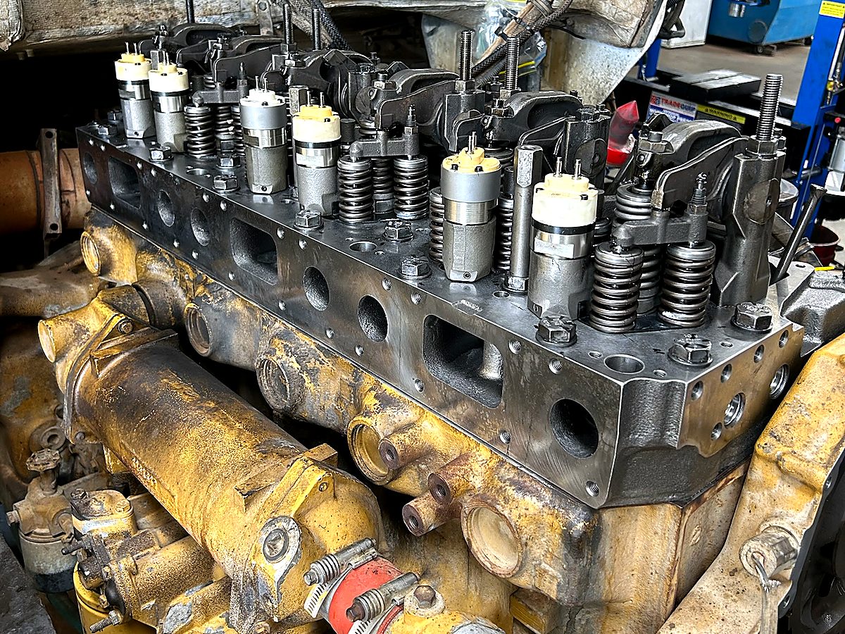 Reconditioned diesel cylinder head and CAT engine block mid-overhaul at the Naturaliste Diesel Services workshop
