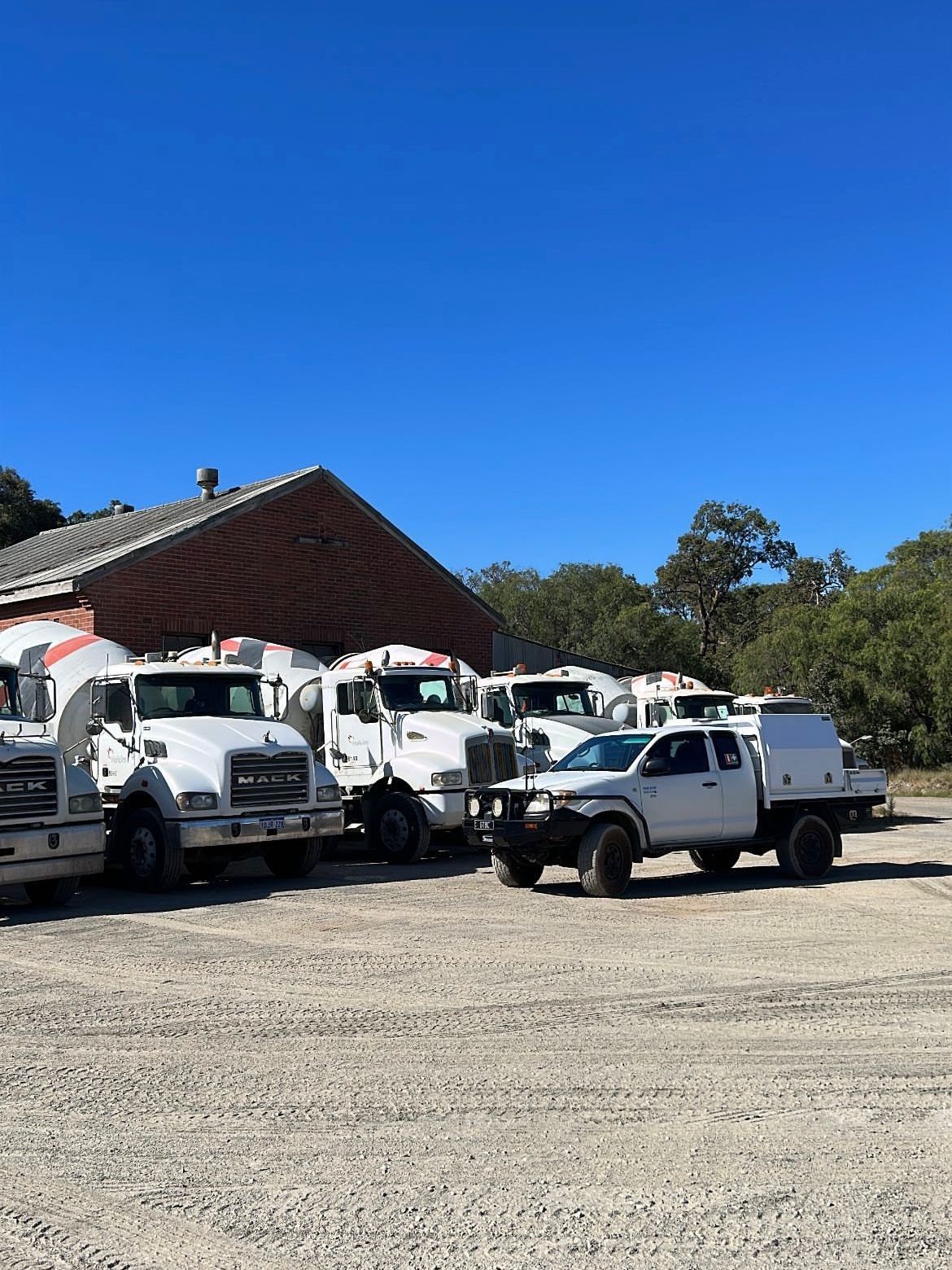 Naturaliste Diesel Services fleet of trucks and a field-service ute lined up at the depot